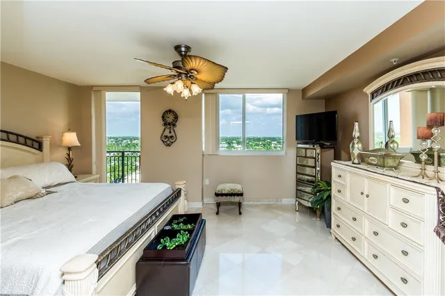 a bedroom with a bed dresser and a window