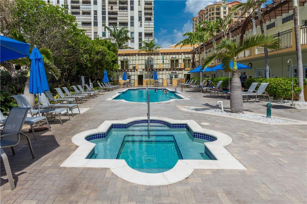 2001 North Ocean Boulevard, Unit 804 Fort Lauderdale, FL 33305 - Photo 34 of 42 a view of a backyard with a patio and fire pit