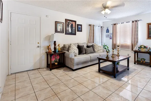 a living room with furniture and a rug