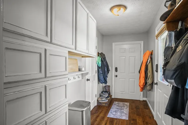 a bedroom with a bed and dresser