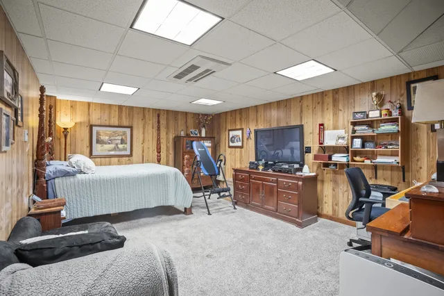 a view of a city from a balcony with furniture