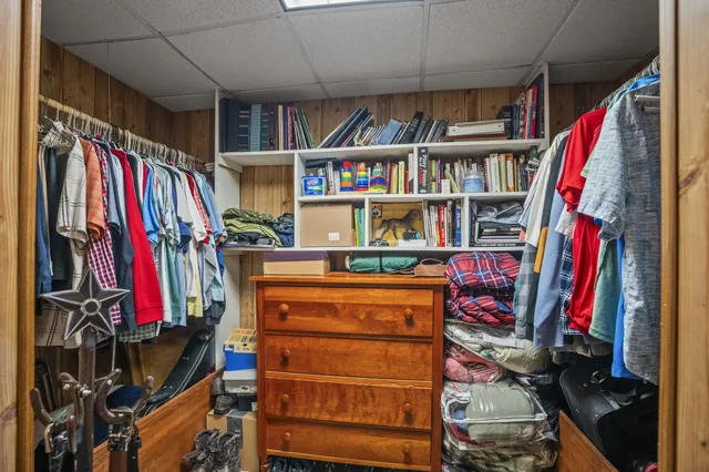 a view of a house with a swimming pool lawn chairs and a small yard