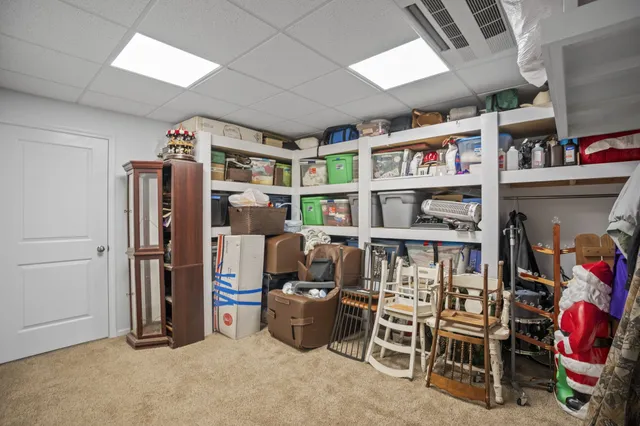 a view of a house with swimming pool and sitting area