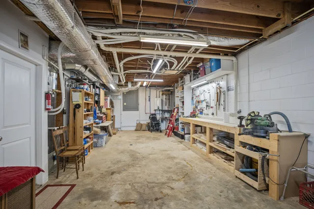a view of a house with pool and sitting area