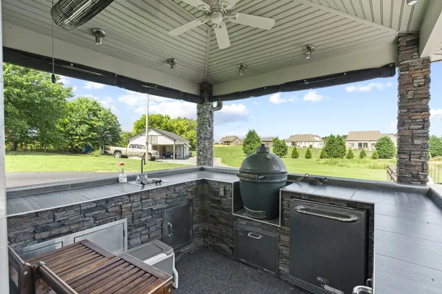 an aerial view of a house with garden space and street view