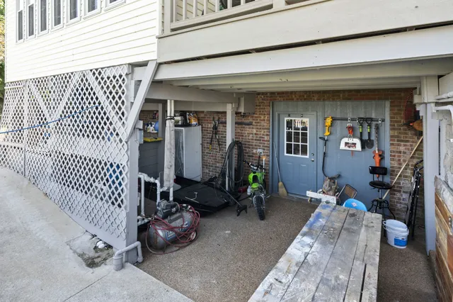 a living room with furniture and floor to ceiling windows