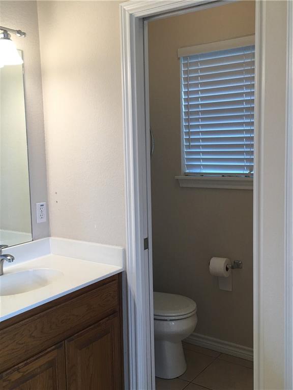 2218 Old Ironsides Road Abilene, TX 79601 - Photo 21 of 26 a bathroom with a sink a toilet and shower