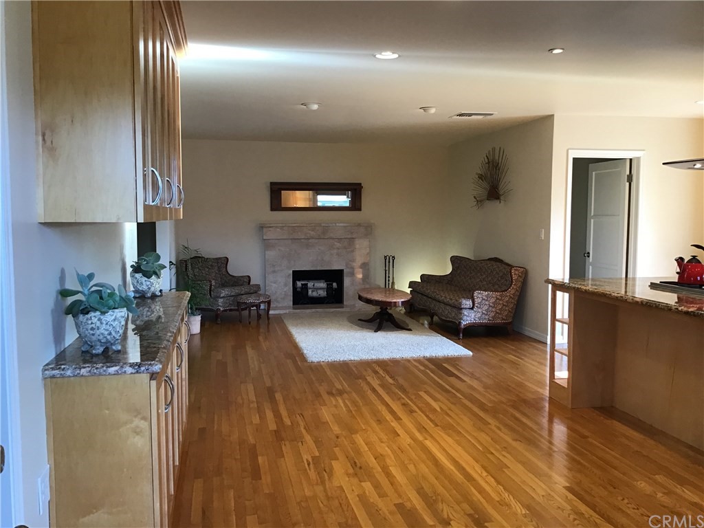 2154 Ostrom Avenue Long Beach, CA 90815 - Photo 14 of 29 a living room with furniture and a fireplace