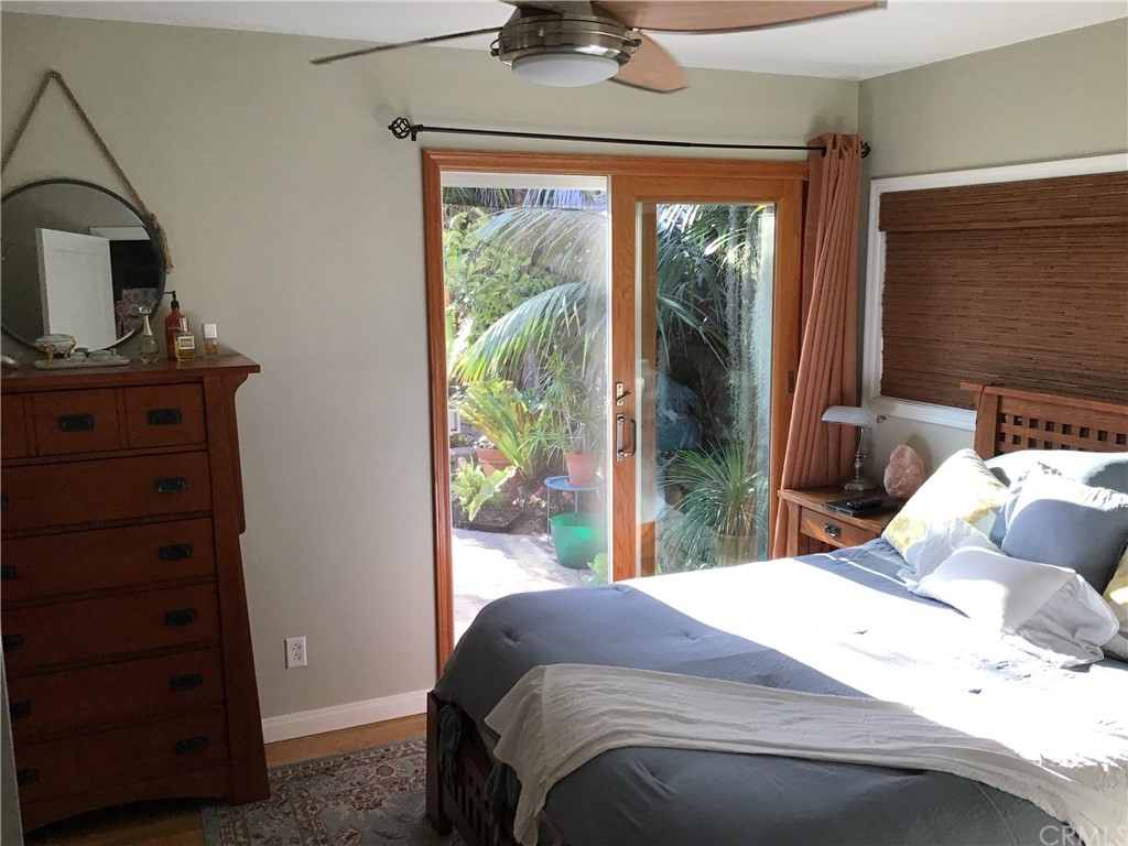 2154 Ostrom Avenue Long Beach, CA 90815 - Photo 16 of 29 a bedroom with a bed and a dresser