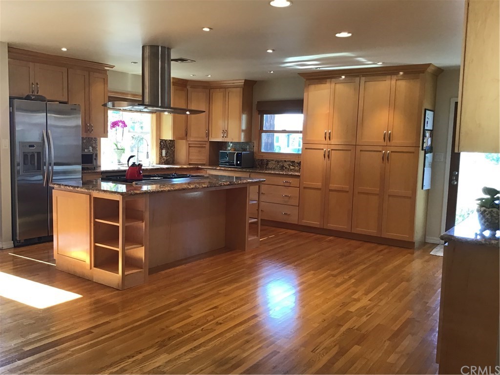 2154 Ostrom Avenue Long Beach, CA 90815 - Photo 3 of 29 a kitchen with stainless steel appliances granite countertop a refrigerator a sink and a stove