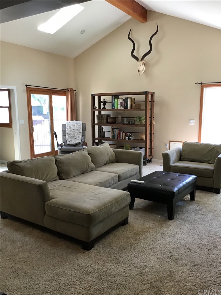 2154 Ostrom Avenue Long Beach, CA 90815 - Photo 8 of 29 a living room with furniture and a ceiling fan