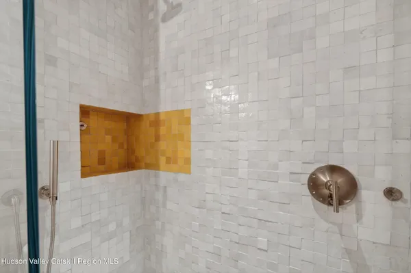 a view of a wooden door and living room