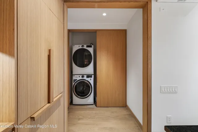 a view of a hallway with washer and dryer