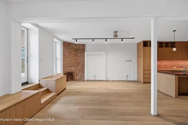 a view of a living room with a rug