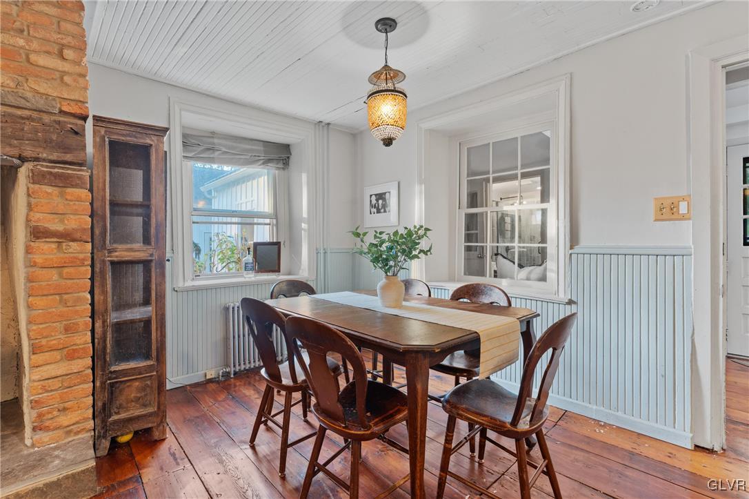 3225 Jordan Road Orefield, PA 18069 - Photo 17 of 50 a dining room with furniture potted plants and wooden floor