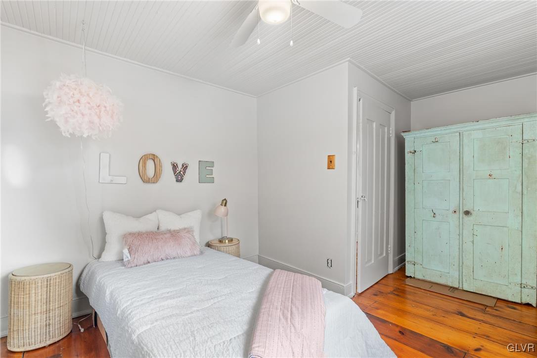 3225 Jordan Road Orefield, PA 18069 - Photo 30 of 50 a bedroom with a bed and a chandelier