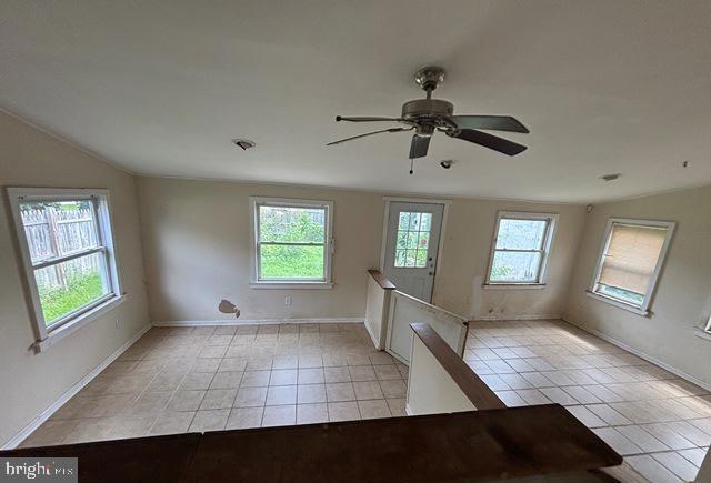 526 Manor Road Beverly, NJ 08010 - Photo 7 of 13 a view of an empty room with window and chandelier fan
