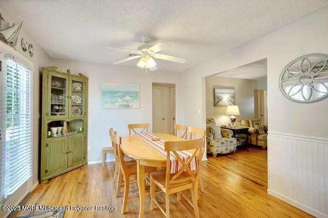 a view of a livingroom with furniture and a window