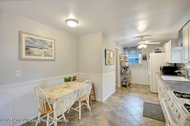 81 Berry Place Long Branch, NJ 07740 - Photo 4 of 11 a kitchen that has a table and chairs in it