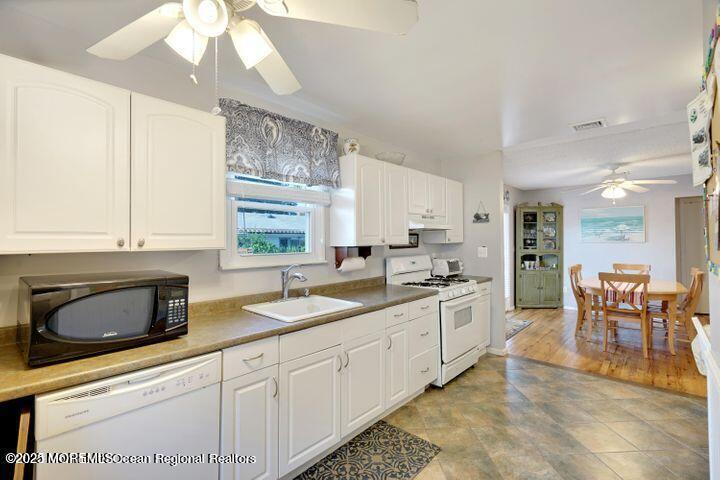 81 Berry Place Long Branch, NJ 07740 - Photo 5 of 11 a kitchen with a sink stove and cabinets