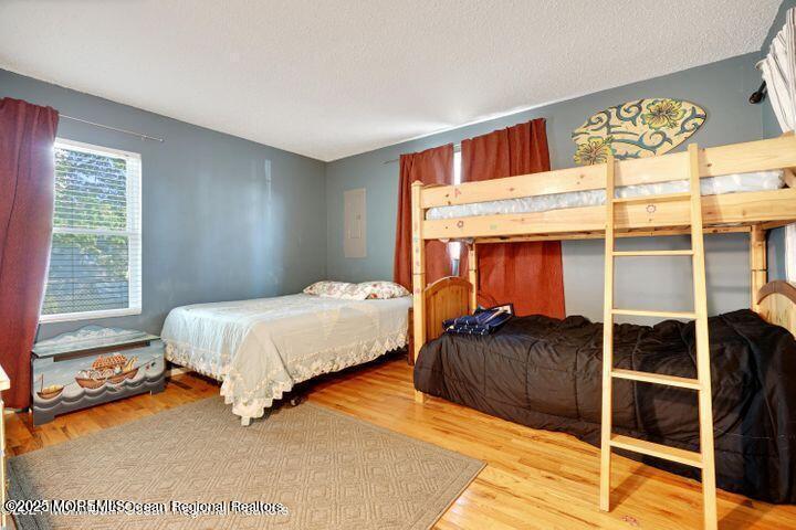 81 Berry Place Long Branch, NJ 07740 - Photo 8 of 11 a bedroom with a bed and a window