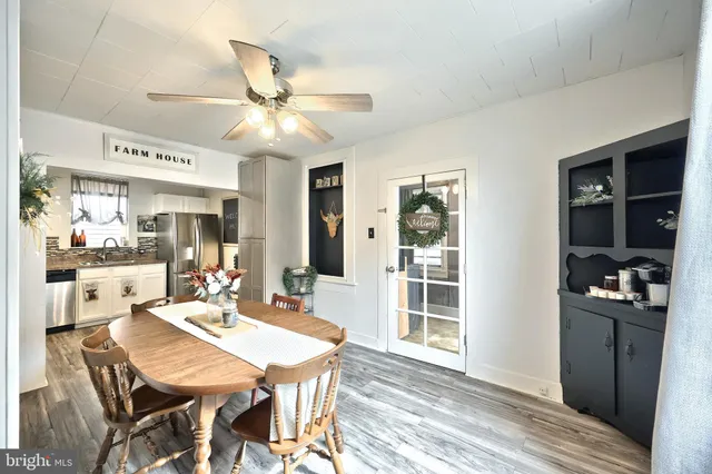 a dining room with furniture and window