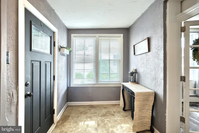 a bathroom with a toilet a sink and a mirror