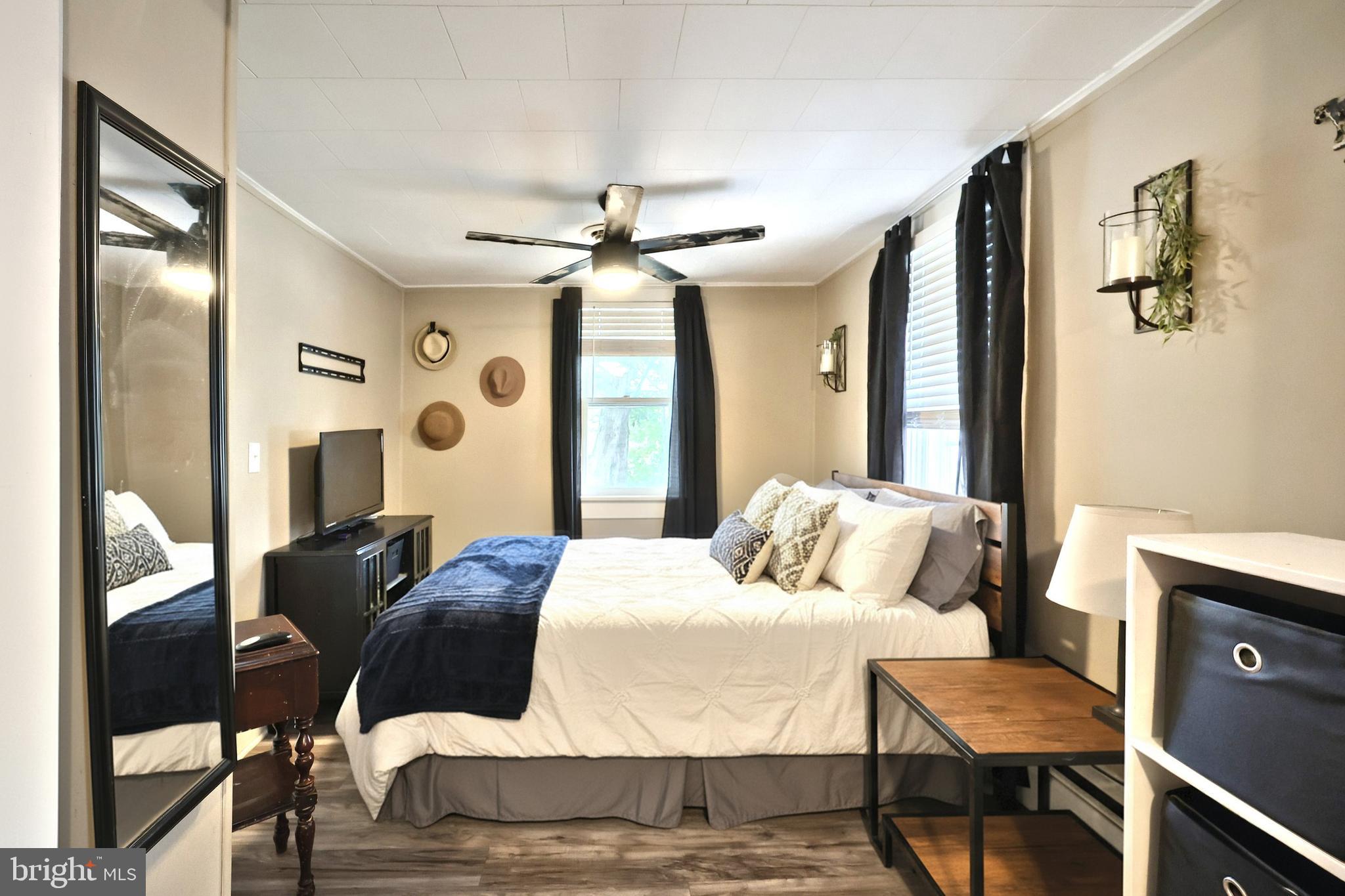 416 South High Street Hanover, PA 17331 - Photo 28 of 37 a bedroom with a bed and wooden floor