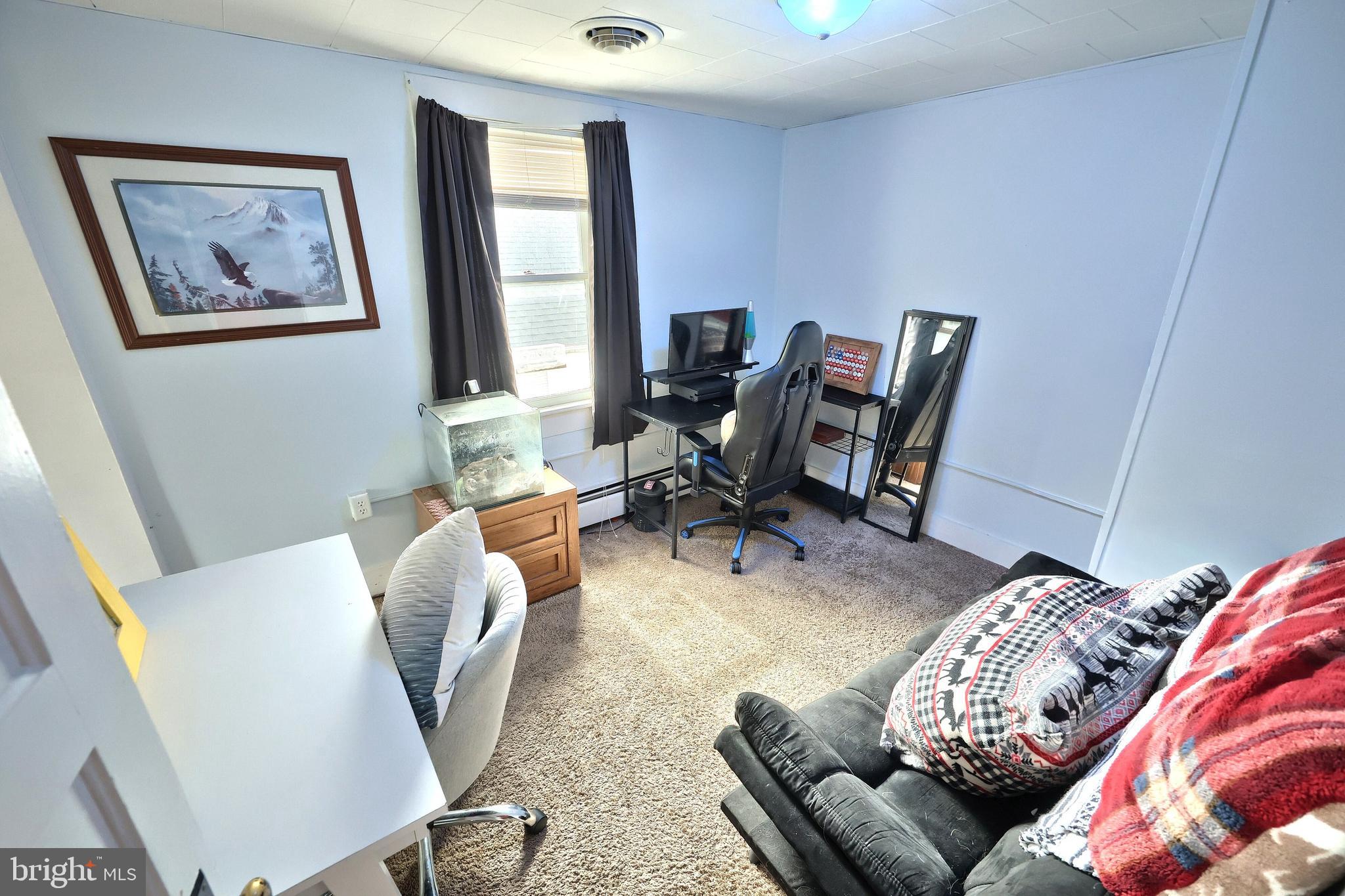 416 South High Street Hanover, PA 17331 - Photo 30 of 37 a view of a livingroom with workspace and a couch