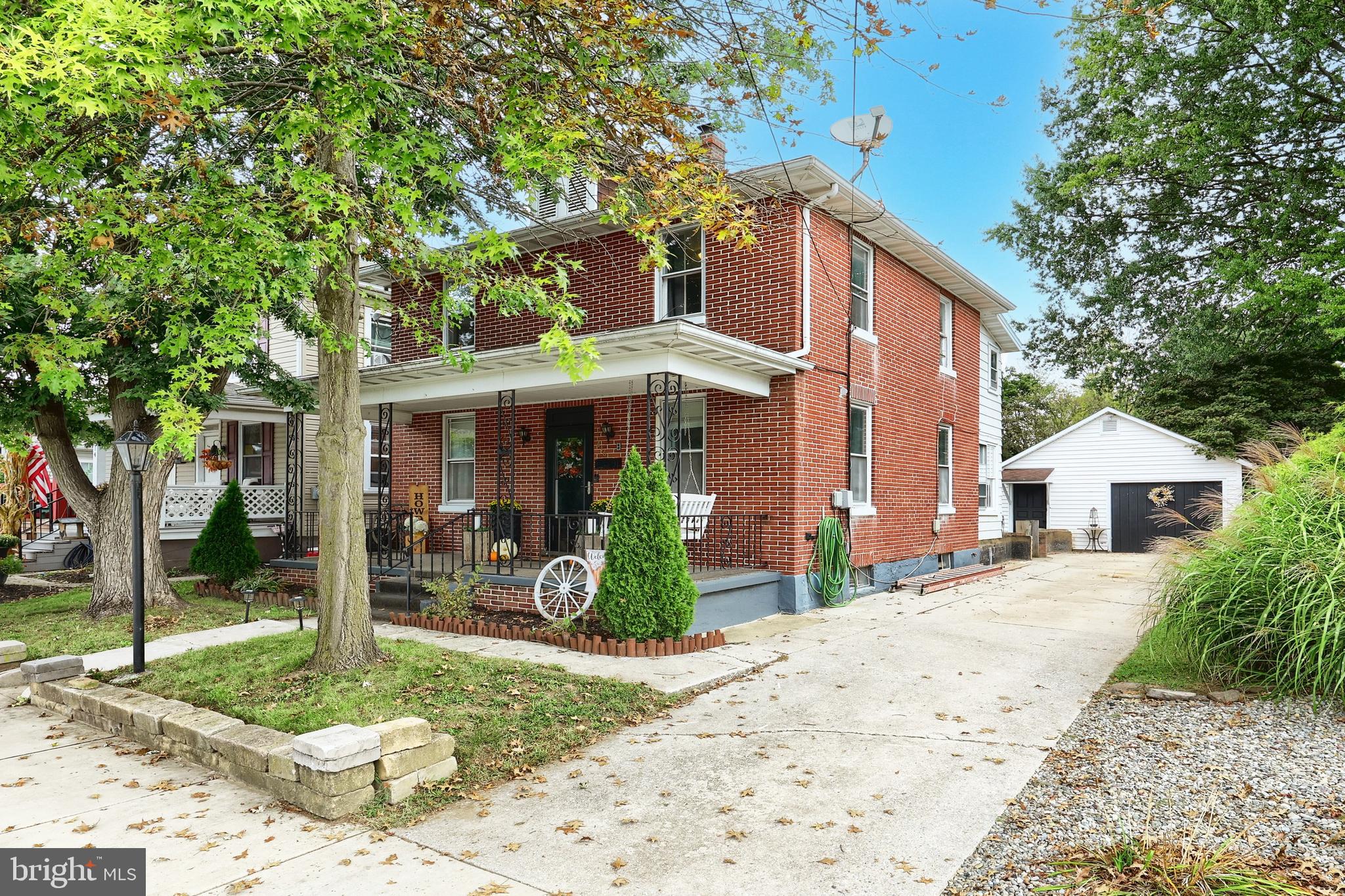 416 South High Street Hanover, PA 17331 - Photo 4 of 37 a front view of a house with garden