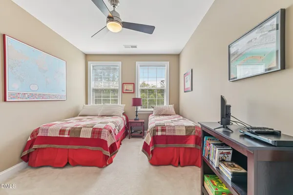 a bedroom with bed and a window