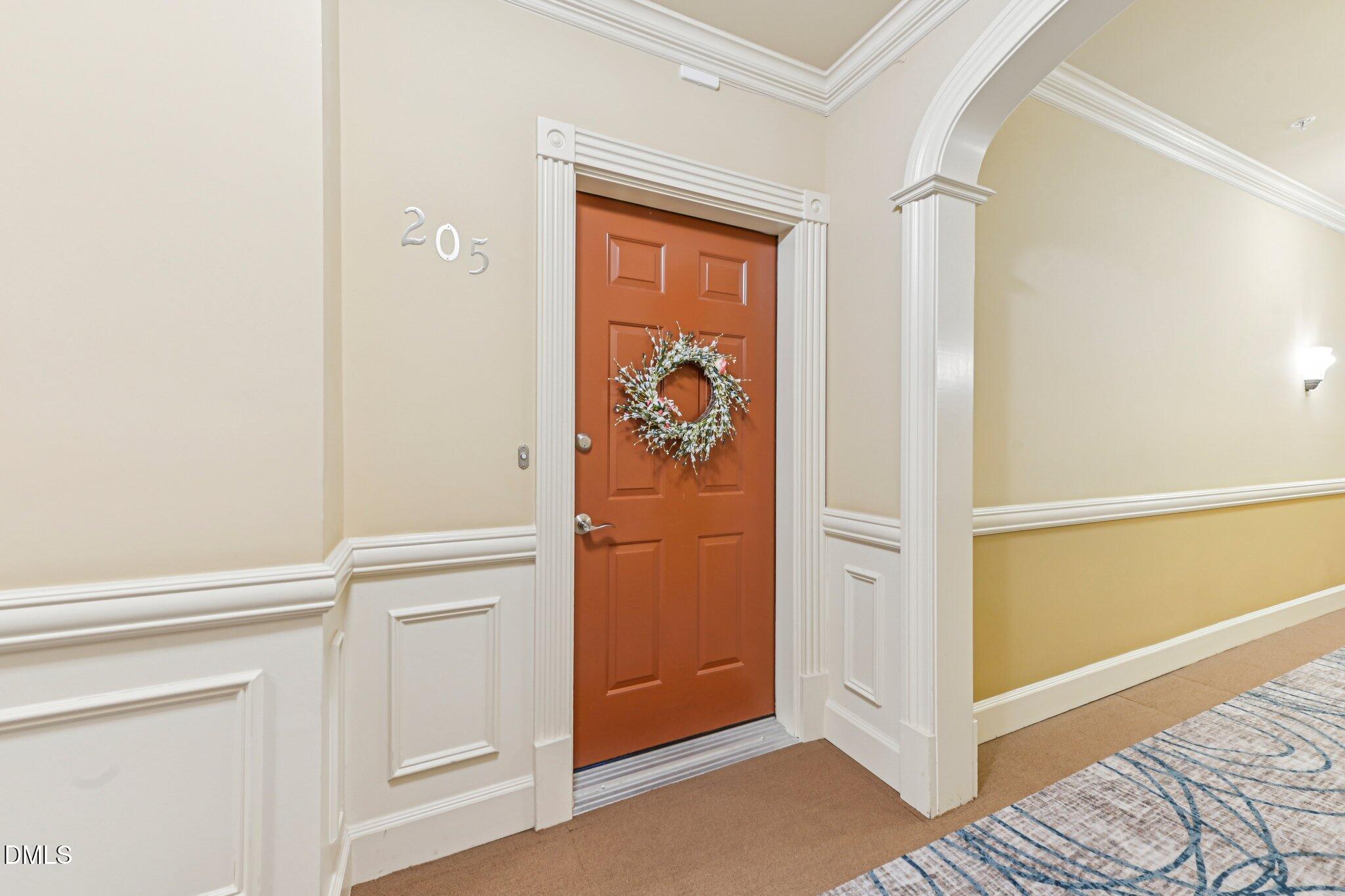 10411 Rosegate Court, Unit 205 Raleigh, NC 27617 - Photo 14 of 38 a view of a hallway with wooden floor and closet