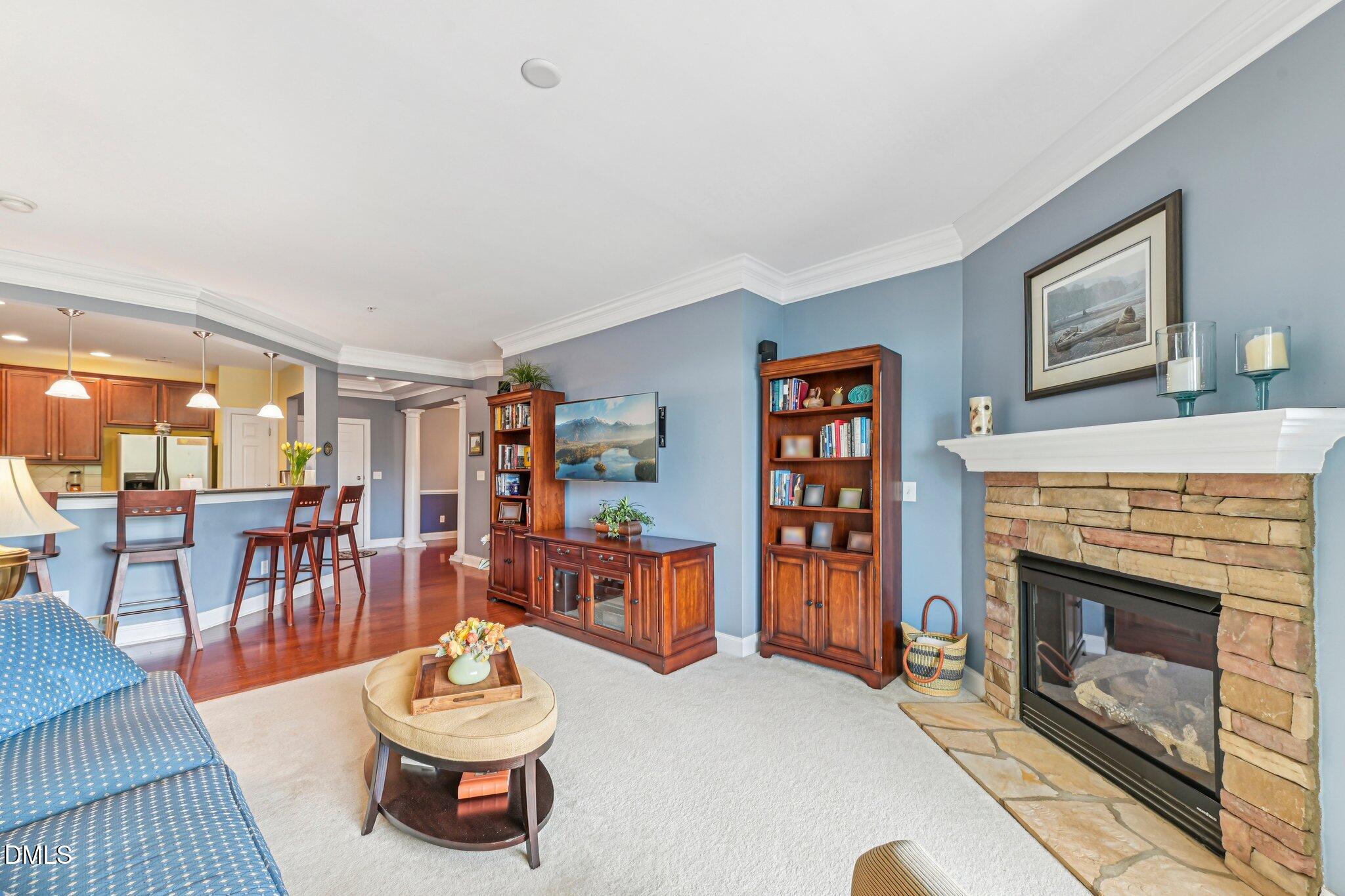 10411 Rosegate Court, Unit 205 Raleigh, NC 27617 - Photo 17 of 38 a living room with furniture and a fireplace