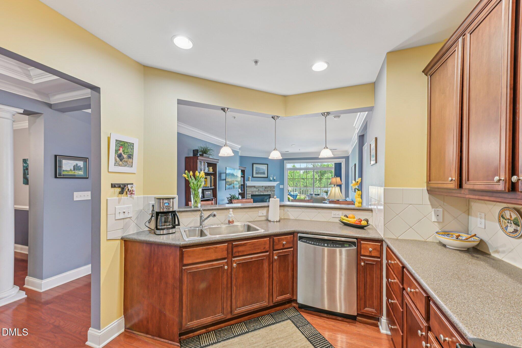 10411 Rosegate Court, Unit 205 Raleigh, NC 27617 - Photo 18 of 38 a kitchen with stainless steel appliances granite countertop a sink and cabinets