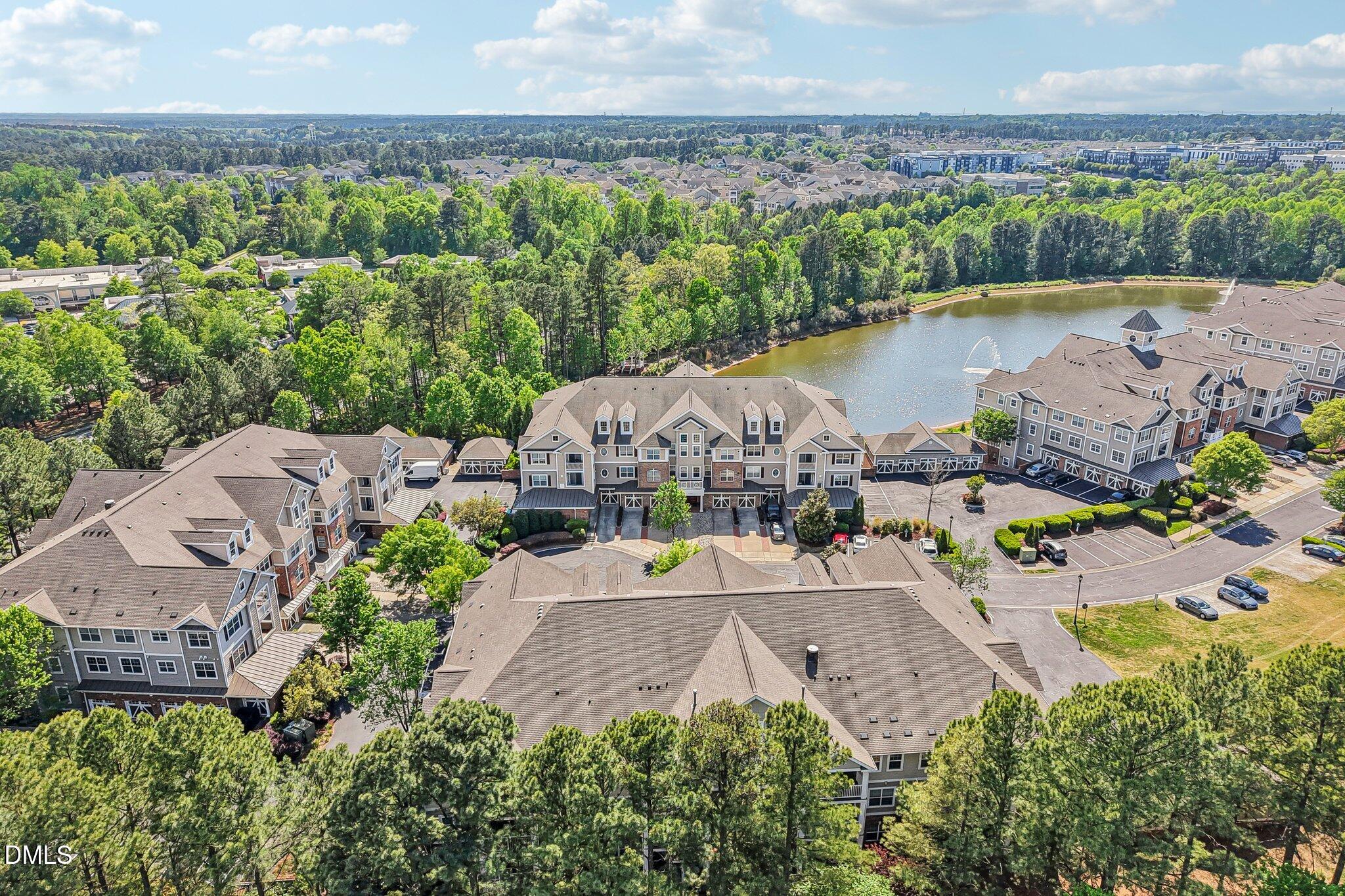 10411 Rosegate Court, Unit 205 Raleigh, NC 27617 - Photo 2 of 38 an aerial view of a house with a garden and lake view