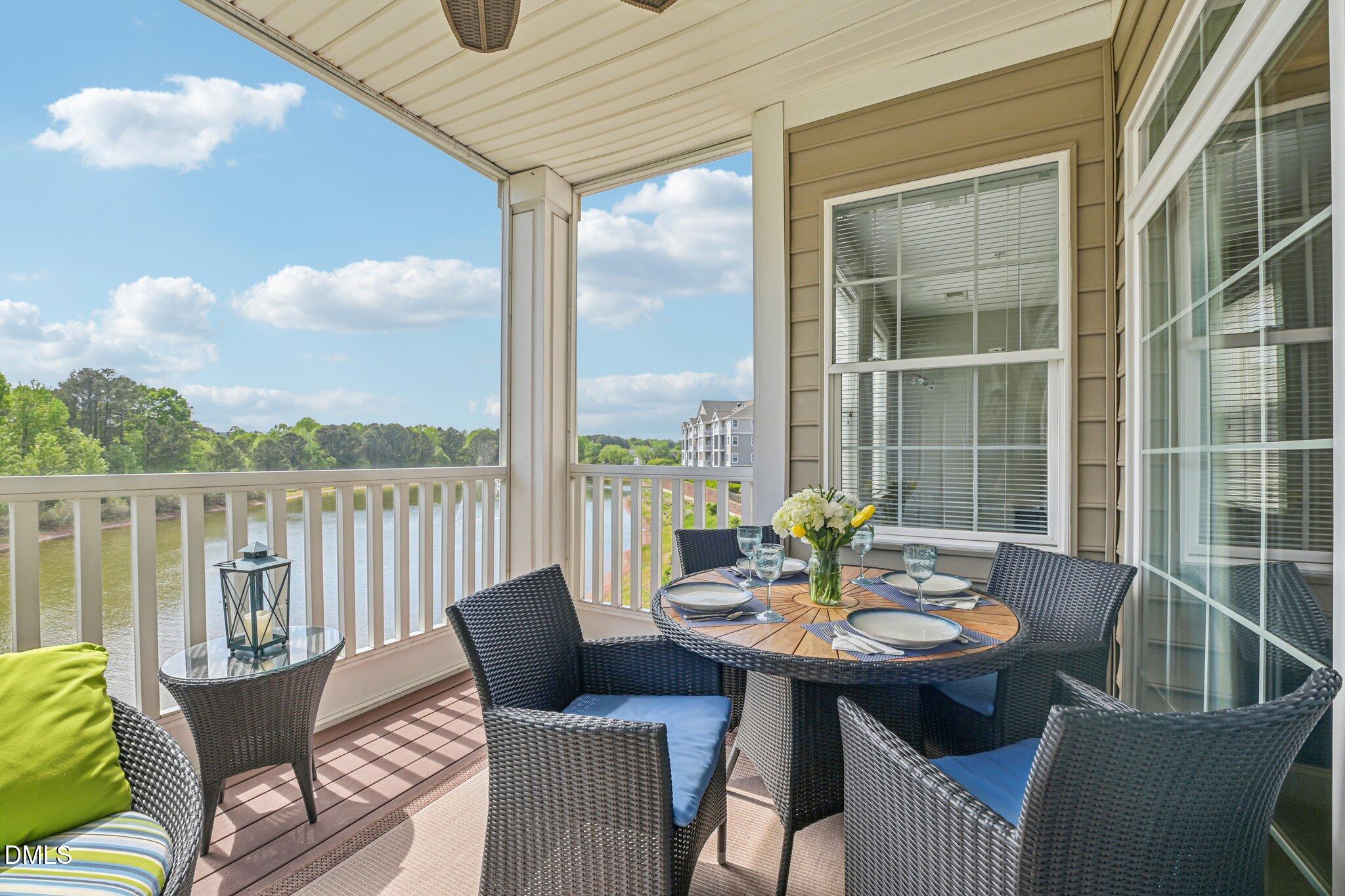10411 Rosegate Court, Unit 205 Raleigh, NC 27617 - Photo 24 of 38 a balcony with table and chairs