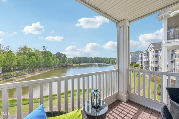 a view of a balcony with wooden floor