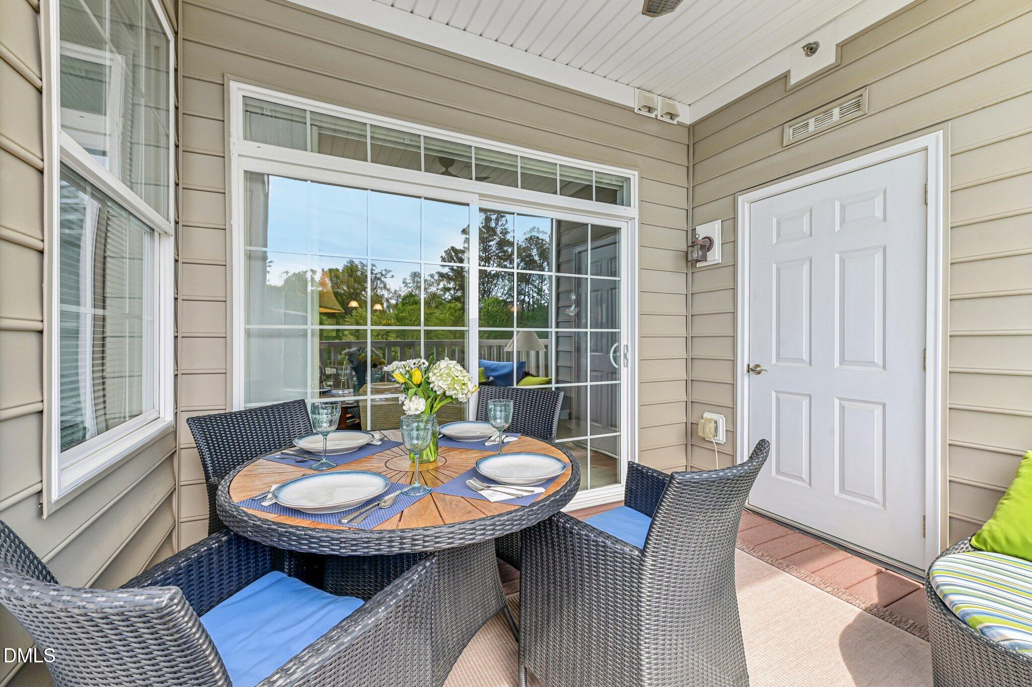 10411 Rosegate Court, Unit 205 Raleigh, NC 27617 - Photo 26 of 38 a view of a dining room with furniture window and wooden floor