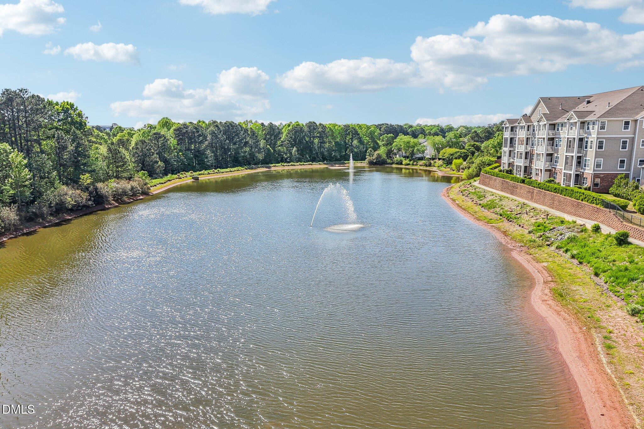 10411 Rosegate Court, Unit 205 Raleigh, NC 27617 - Photo 3 of 38 a view of a lake with a city view