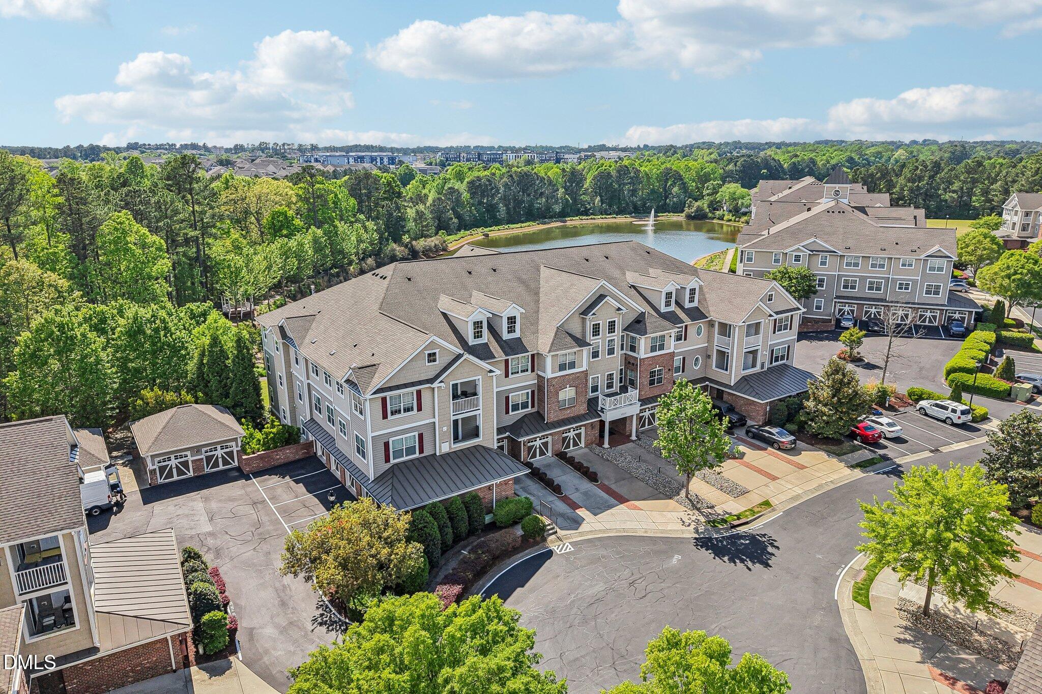 10411 Rosegate Court, Unit 205 Raleigh, NC 27617 - Photo 35 of 38 an aerial view of a house with a garden and lake view