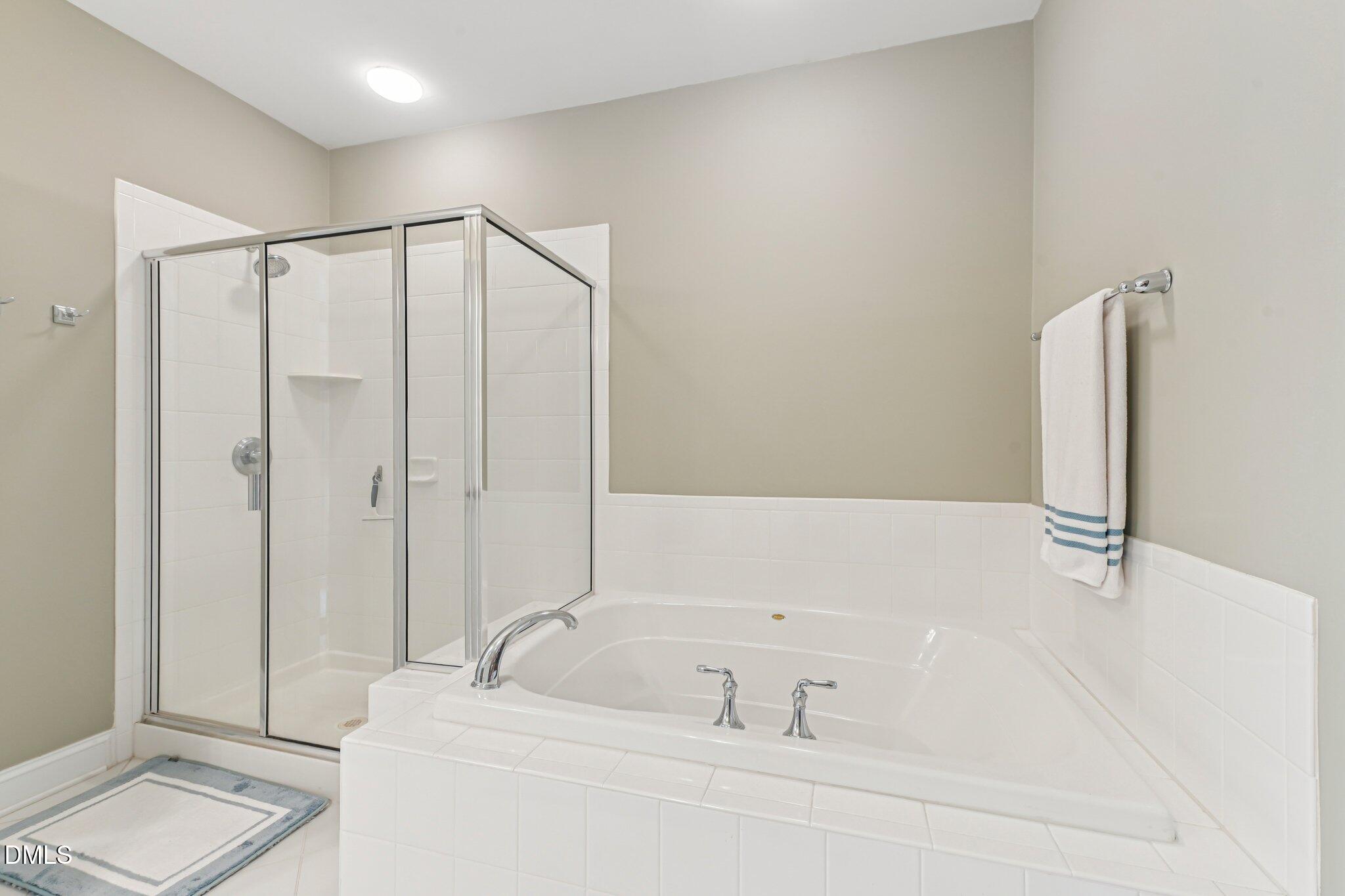 10411 Rosegate Court, Unit 205 Raleigh, NC 27617 - Photo 10 of 38 a bathroom with a bathtub and a sink