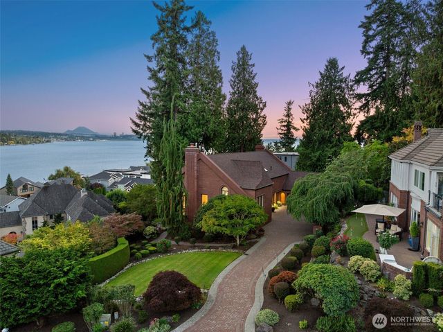 a aerial view of a house with garden space and lake view