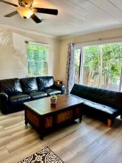 304 Southeast 3rd Avenue Delray Beach, FL 33483 - Photo 2 of 8 a living room with furniture and a large window