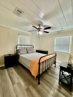 304 Southeast 3rd Avenue Delray Beach, FL 33483 - Photo 4 of 8 a bedroom with a bed and window