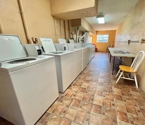 a living room with a couch and chairs