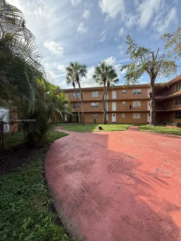 a view of a yard with a bench