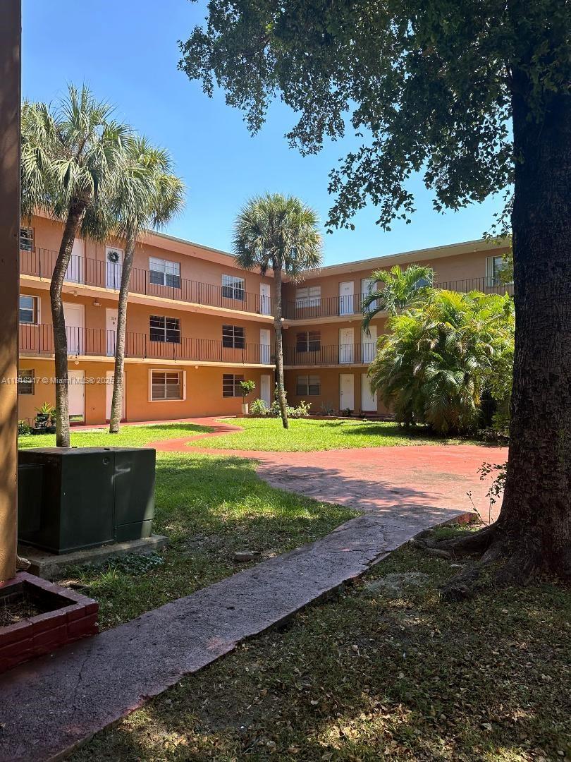 1280 West 54th Street, Unit 322B Hialeah, FL 33012 - Photo 9 of 14 a view of outdoor space yard and house