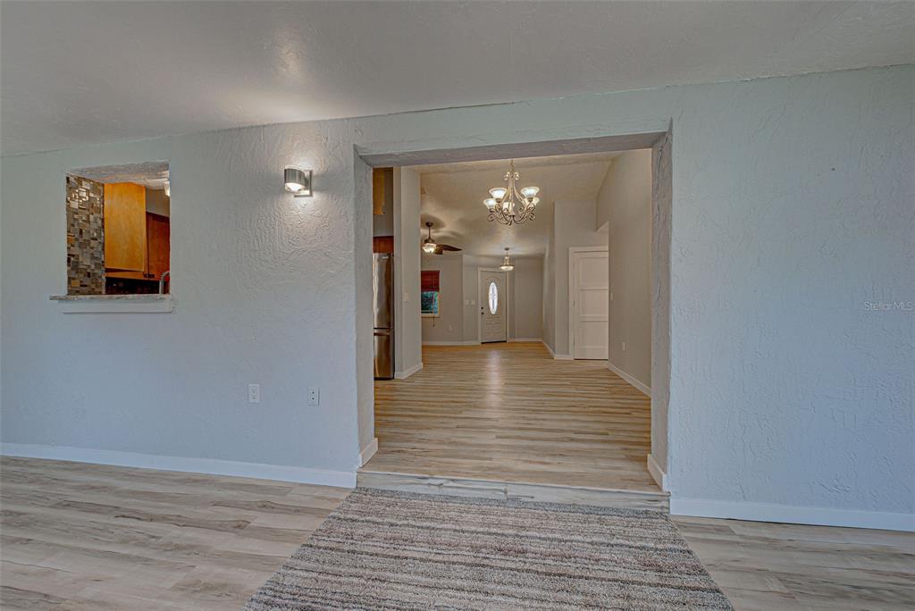 3187 Galiot Road Venice, FL 34293 - Photo 18 of 46 a view of a hallway with wooden floor