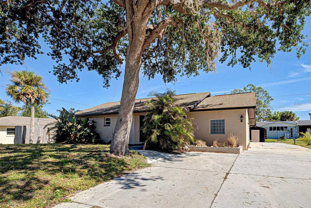 3187 Galiot Road Venice, FL 34293 - Photo 2 of 46 a view of a house with a tree in front of it