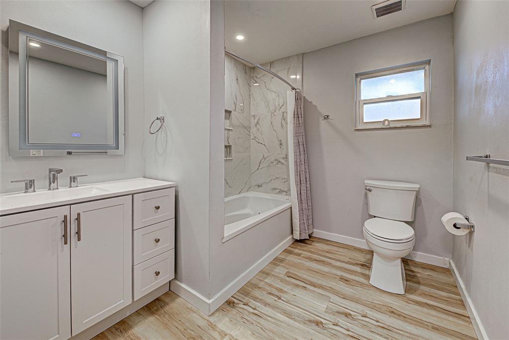 3187 Galiot Road Venice, FL 34293 - Photo 36 of 46 a bathroom with a sink a toilet and shower